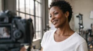 Woman with natural skin texture mid-shoot in studio, real light real face